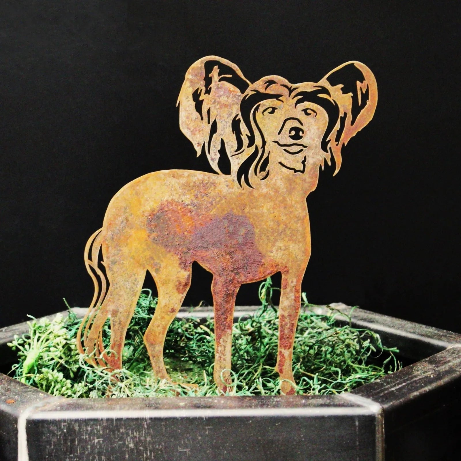 Handcrafted metal silhouette of a Chinese Crested dog in a rust patina, ideal for outdoor garden decor.