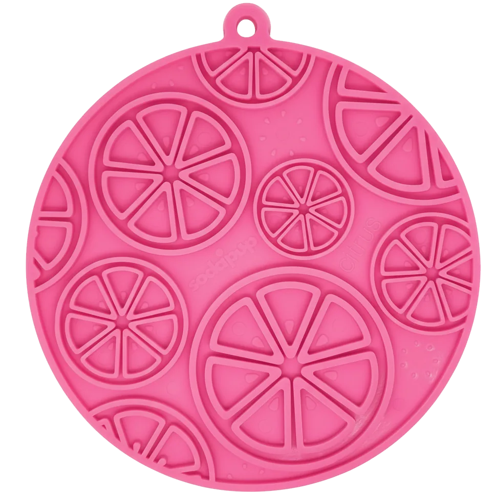 Bright pink Citrus Design eMat with circular shape and raised citrus patterns, perfect for enriching dogs and cats.
