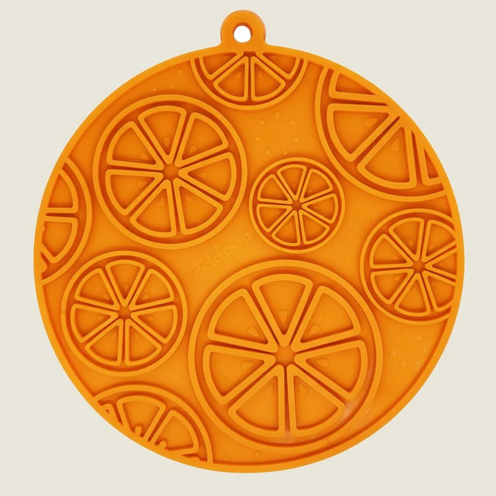 Bright orange Citrus Design eMat features a textured, multi-circle pattern, ideal for engaging pets during treat time.