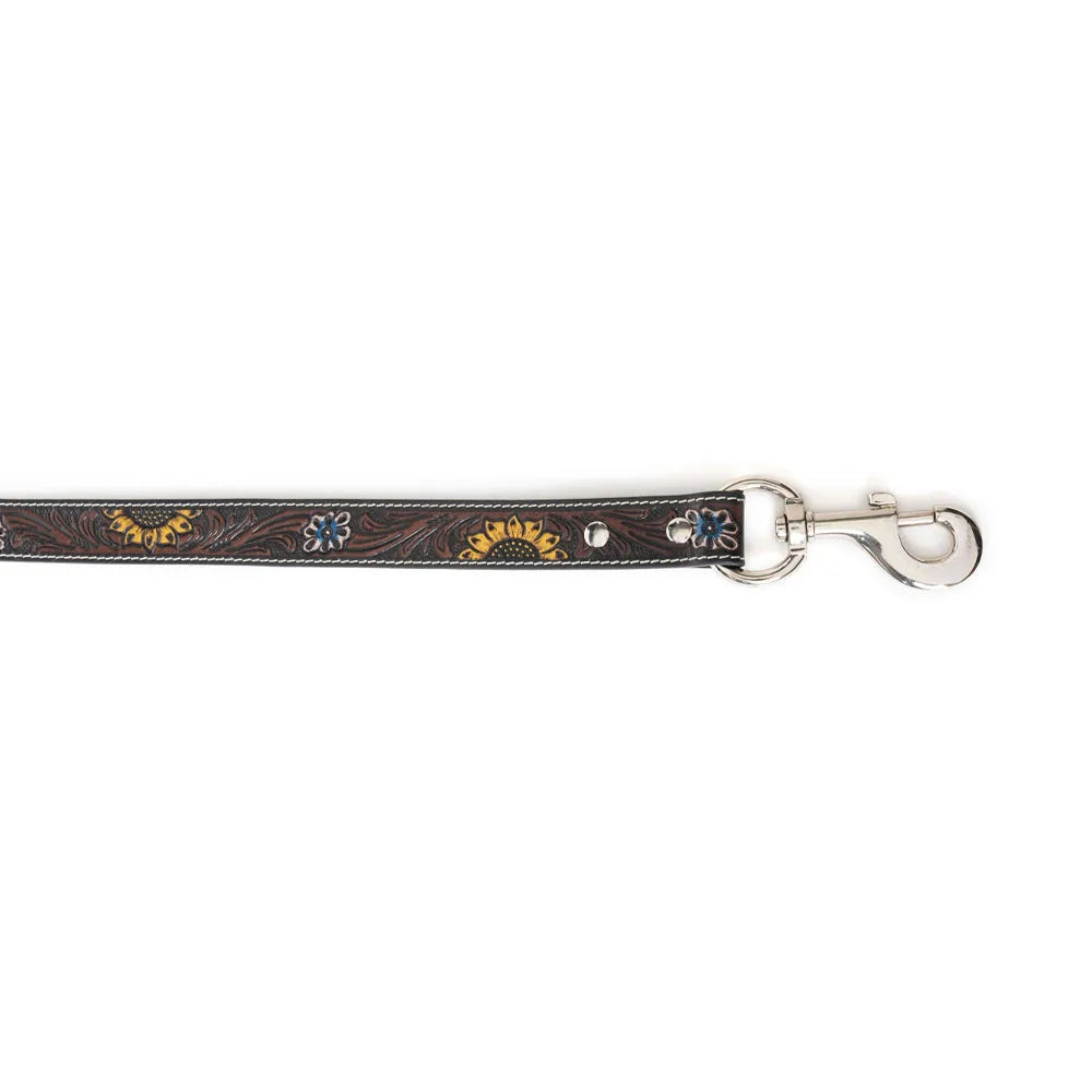 Dark brown hand-tooled leather dog leash with floral embossing and metallic accents, featuring a sturdy clasp.
