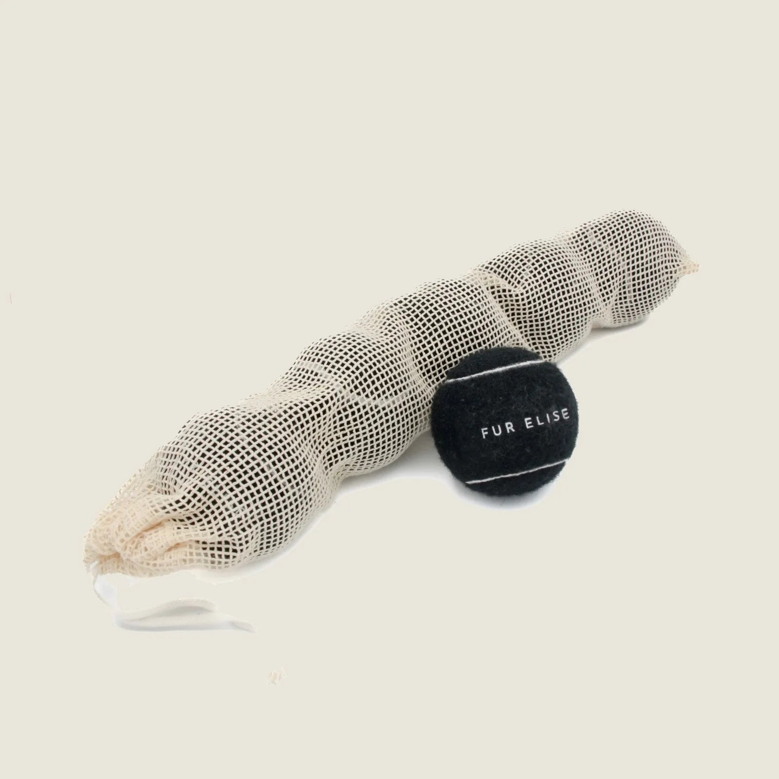 Set of five black tennis balls in a mesh bag, designed for durable dog play, featuring "FUR ELISE" text.