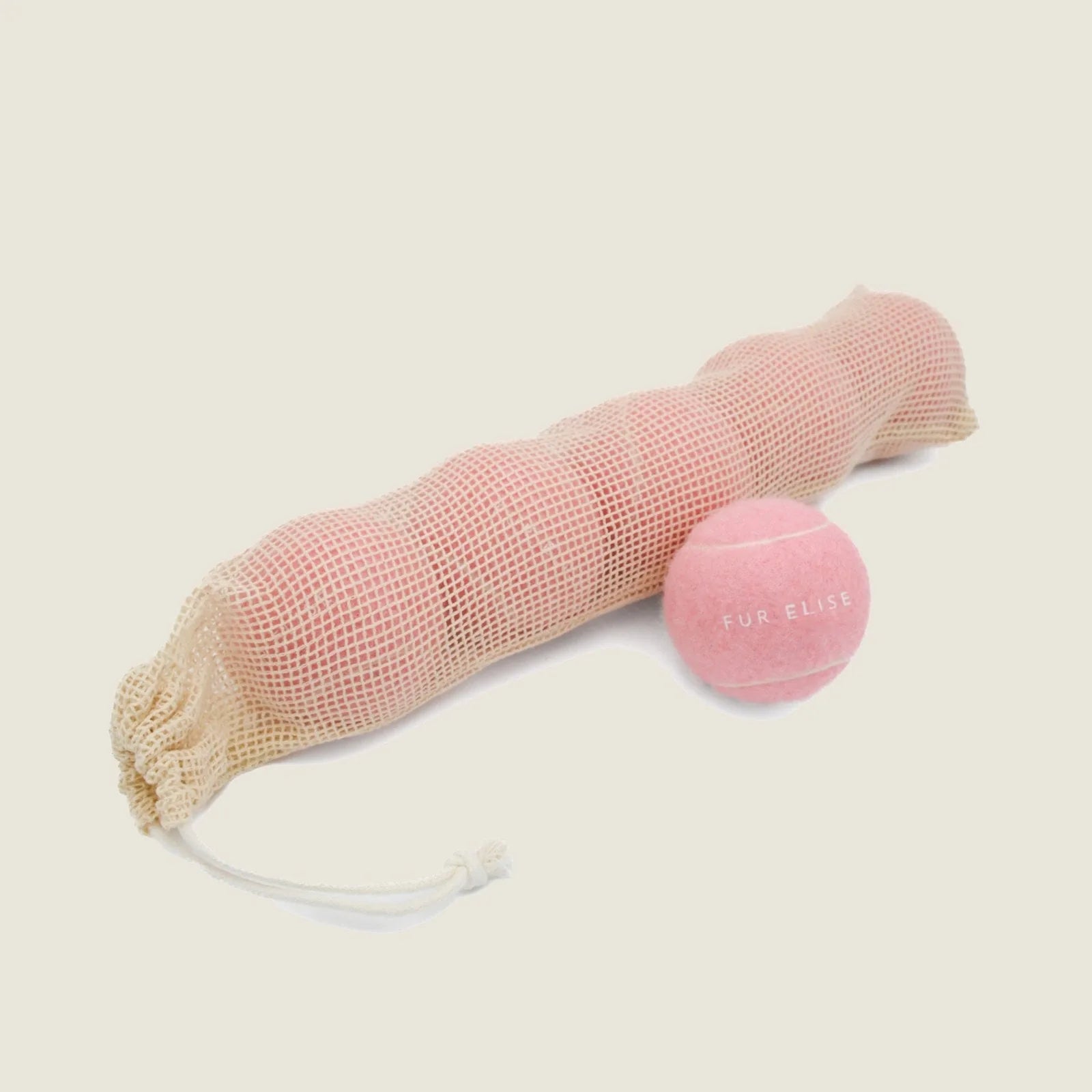 Set of five rose-colored tennis balls in a mesh pouch with drawstring, perfect for dogs' fetch play.