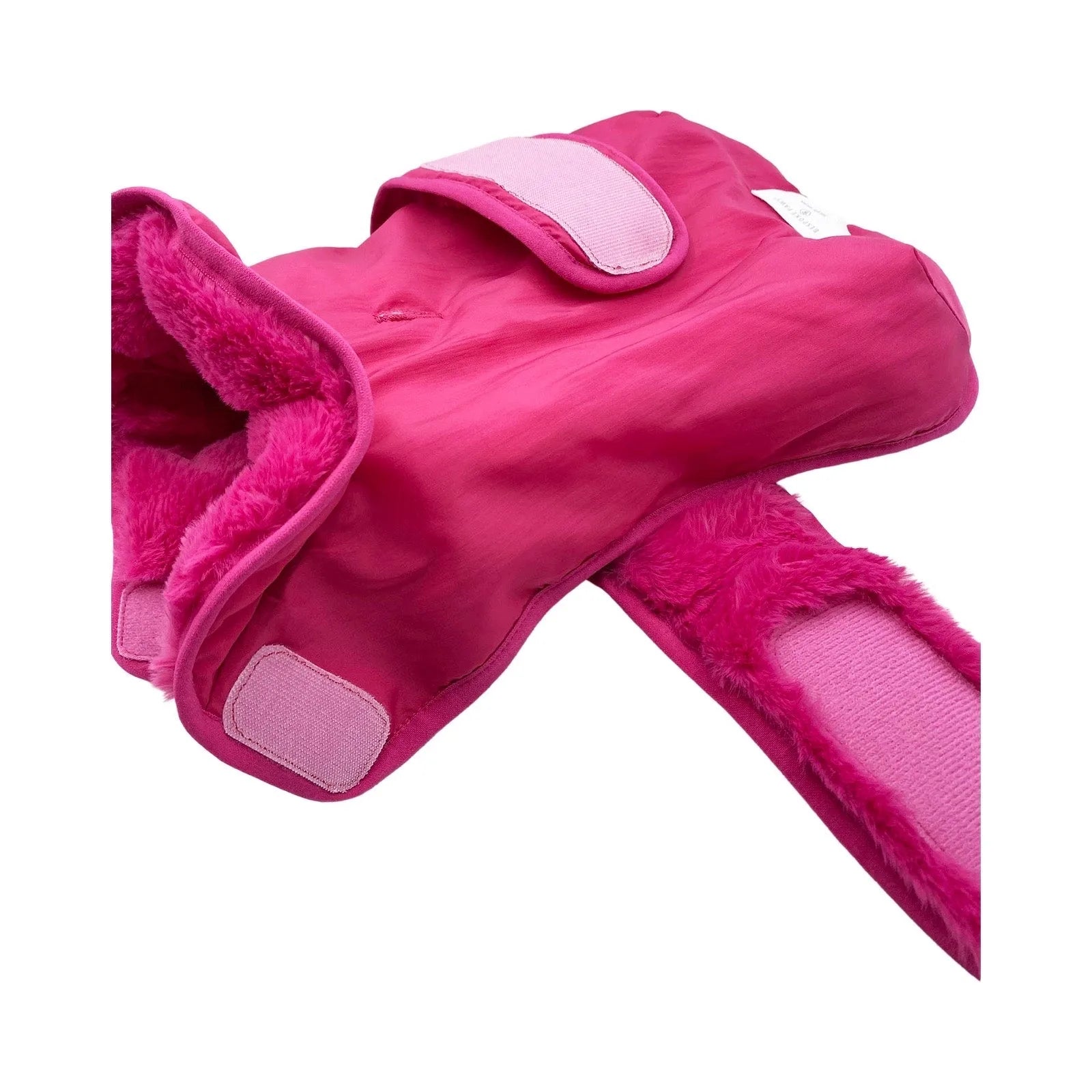 Hot pink faux fur vest with adjustable straps, soft lining, and Velcro closures for a secure fit for dogs.