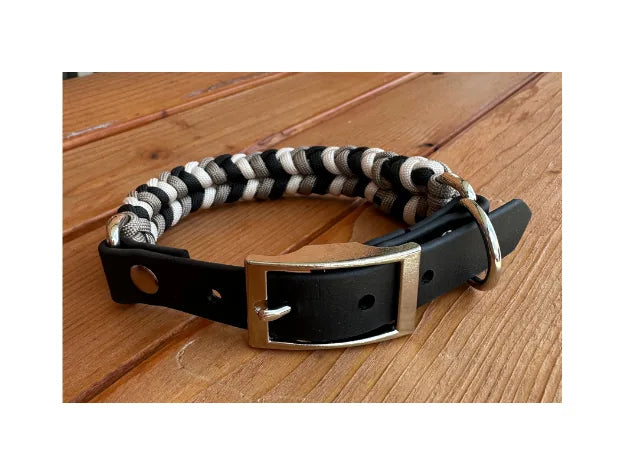 Hand-braided dog collar in black, tan, and cream with nickel plated hardware and D-ring for leash attachment.