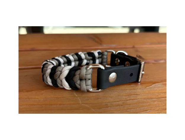 Hand-braided dog collar in black, tan, and cream with a durable BioThane® strap and nickel plated hardware.