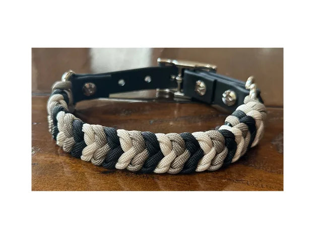 Hand-braided dog collar in black, tan, and cream with nylon paracord and adjustable fit adapter for durability.