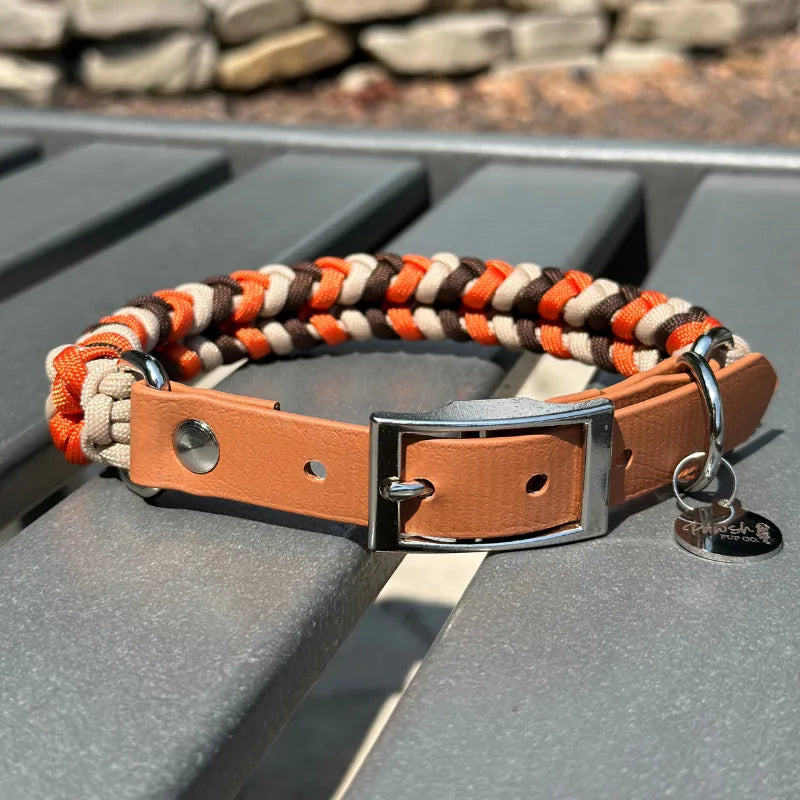 Handcrafted dog collar featuring a handwoven braid in burnt orange, walnut brown, and light tan with a durable tan strap.