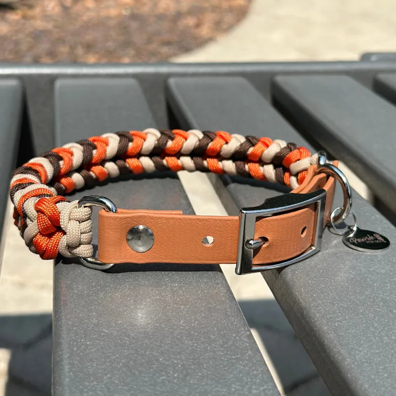 Hand-braided dog collar in burnt orange, walnut brown, and light tan with an adjustable light brown strap and nickel-plate...