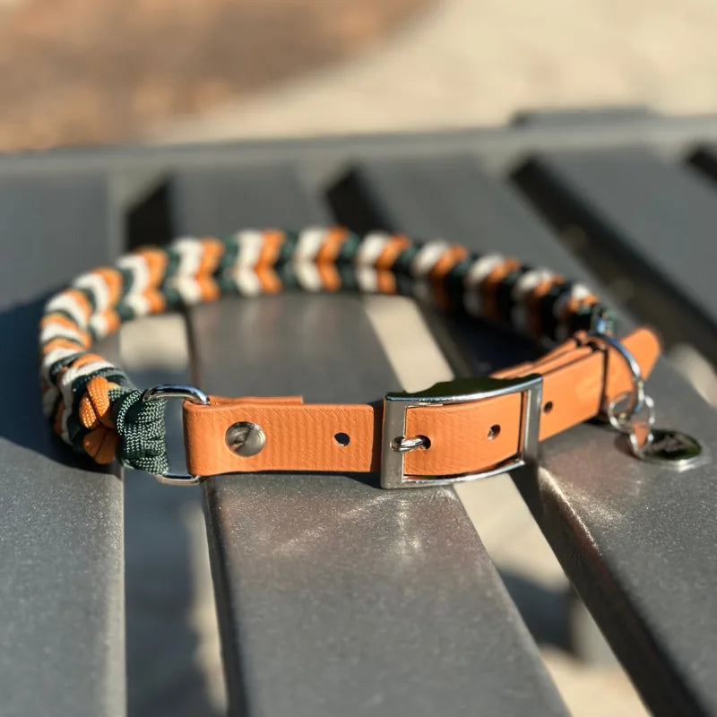 Handmade braided dog collar in hunter green, mustard yellow, and cream with light brown adjustable strap and D-ring.