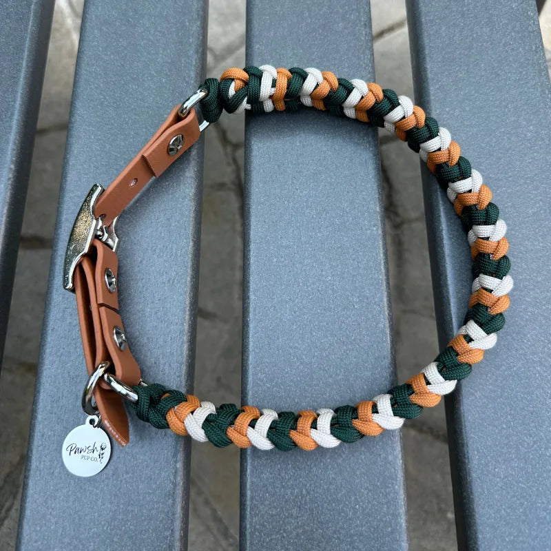Handmade dog collar featuring braided hunter green, mustard yellow, and cream paracord with a light brown adjustable strap.