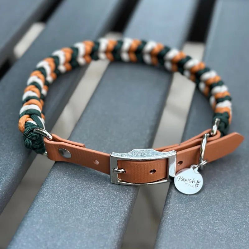 Handmade braided dog collar in hunter green, mustard yellow, and cream with a brown adjustable strap and metal buckle.