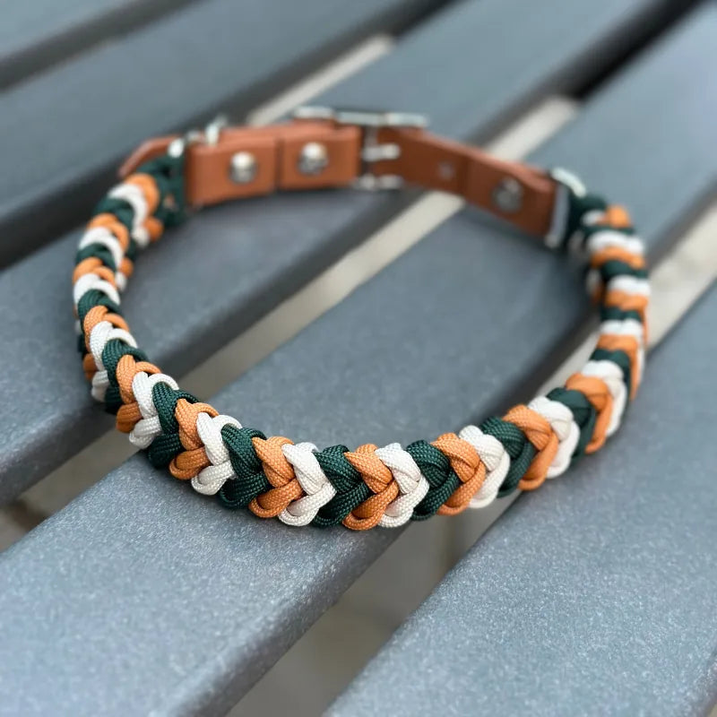 Handmade braided dog collar in hunter green, mustard yellow, and cream, featuring an adjustable brown strap and D-ring.