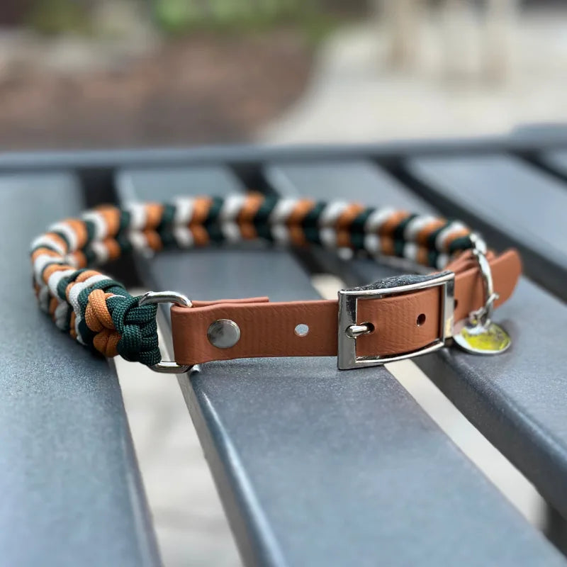 Handmade dog collar in hunter green, mustard yellow, and cream, featuring a leather adjustable strap and D-ring.