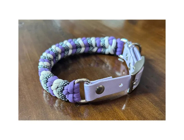Handmade braided dog collar in lilac purple, cream, and black silver pattern with adjustable pastel purple buckle.