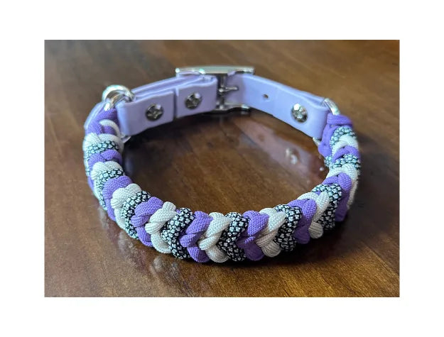 Handmade dog collar in lilac, cream, and black/silver diamond pattern with adjustable pastel purple buckle.