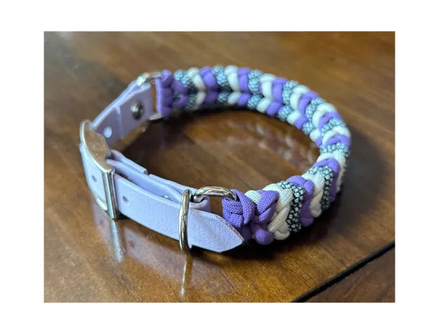 Handmade dog collar featuring a lilac, cream, and black-silver braid, with a pastel purple buckle and D-ring.