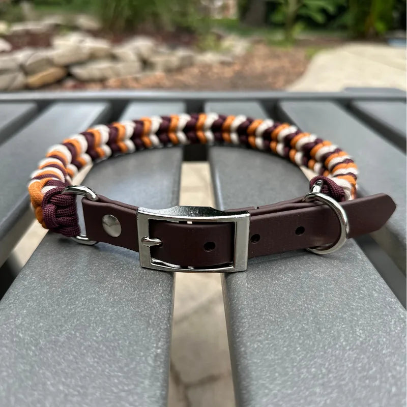 Handmade braided dog collar in mustard yellow, burgundy, and cream with a dark brown adjustable strap and D-ring.