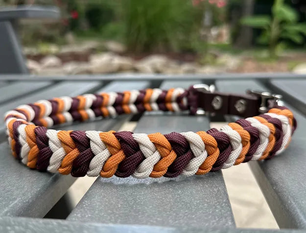 Handmade braided dog collar in mustard yellow, burgundy, and cream, featuring durable nylon paracord and adjustable strap.