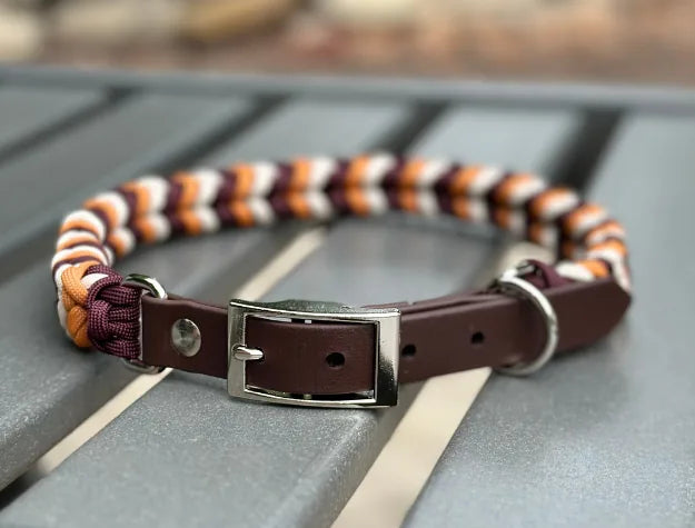 Handmade braided dog collar featuring mustard yellow, burgundy, and cream colors with a dark brown adjustable strap.
