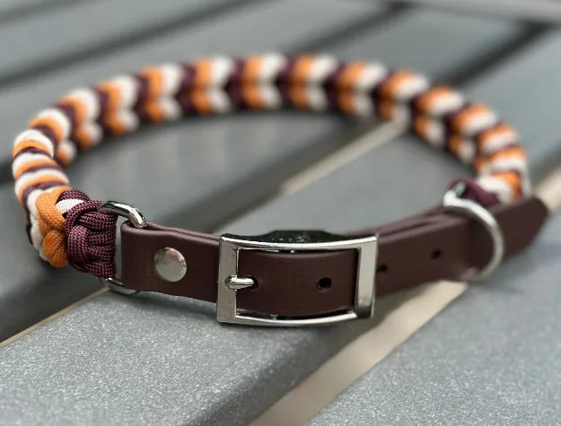 Handmade dog collar featuring a braided design in mustard yellow, burgundy, and cream, with a dark brown adjustable strap.