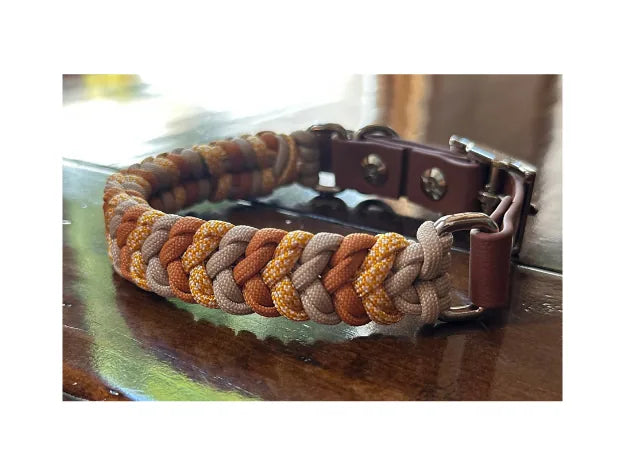 Handmade dog collar featuring mustard yellow, goldenrod, and light tan braided paracord with a brown buckle.