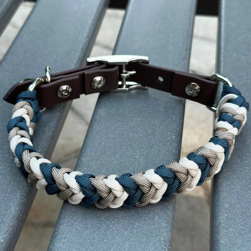 Hand-braided dog collar in navy, tan, and cream with dark brown strap and nickel plated buckle. Ideal for walking.