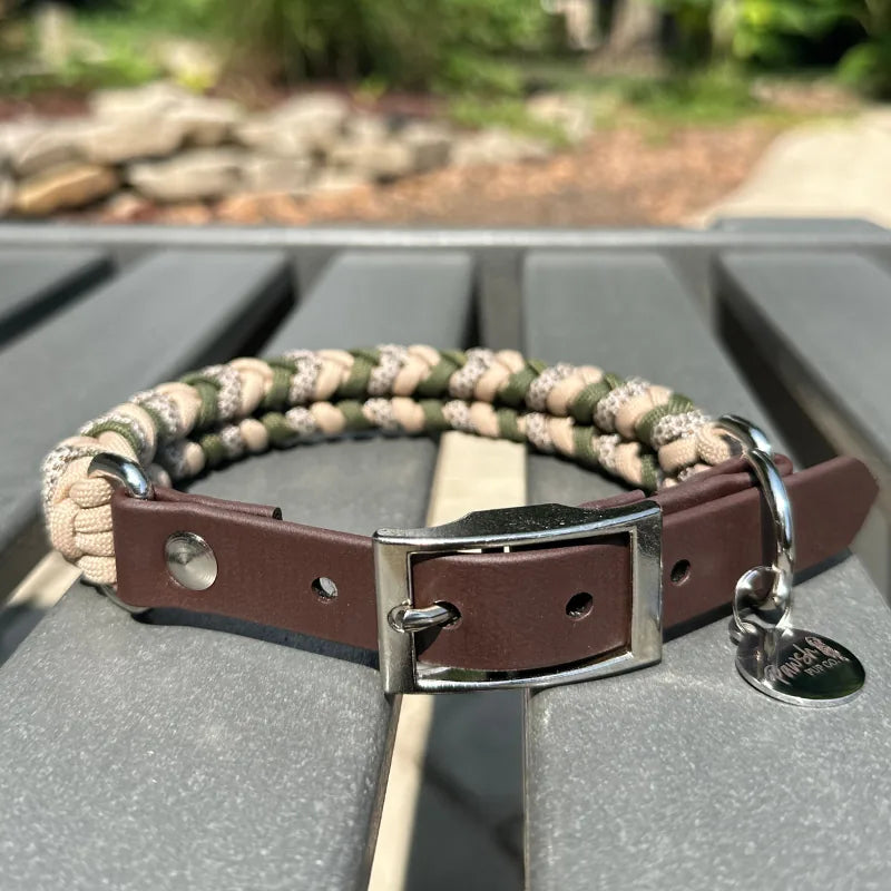 Hand-braided dog collar in olive green, light tan, and coyote brown with a dark brown adjustable strap and nickel buckle.