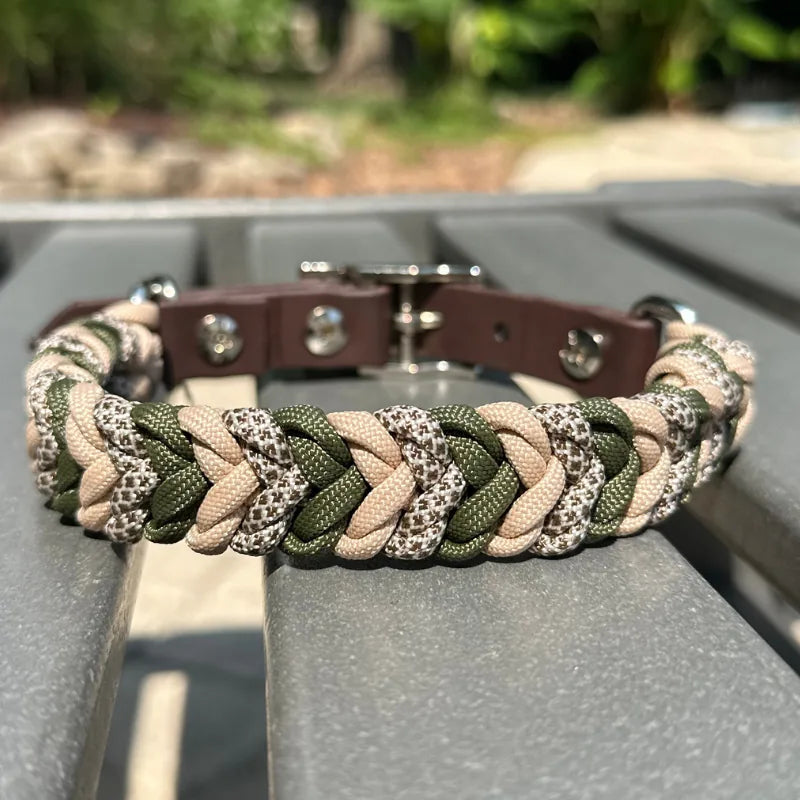 Hand-braided dog collar in olive green, light tan, and coyote brown with a dark brown adjustable strap and buckle.