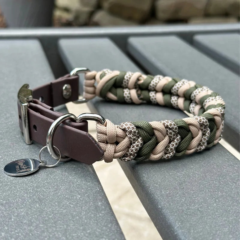 Hand-braided dog collar in olive green, light tan, and coyote brown, featuring a dark brown strap and metal D-ring.