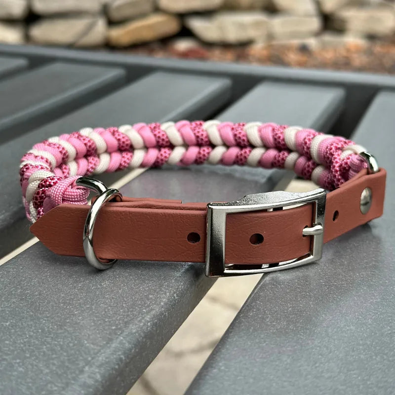 Hand braided dog collar in soft pink, cream, and red diamond pattern with brown adjustable strap and nickel plated buckle.