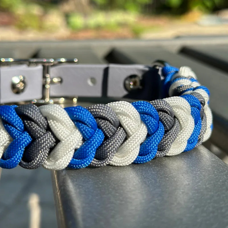 Hand-braided dog collar in royal blue, graphite gray, and white with a gray adjustable strap and nickel-plated buckle.