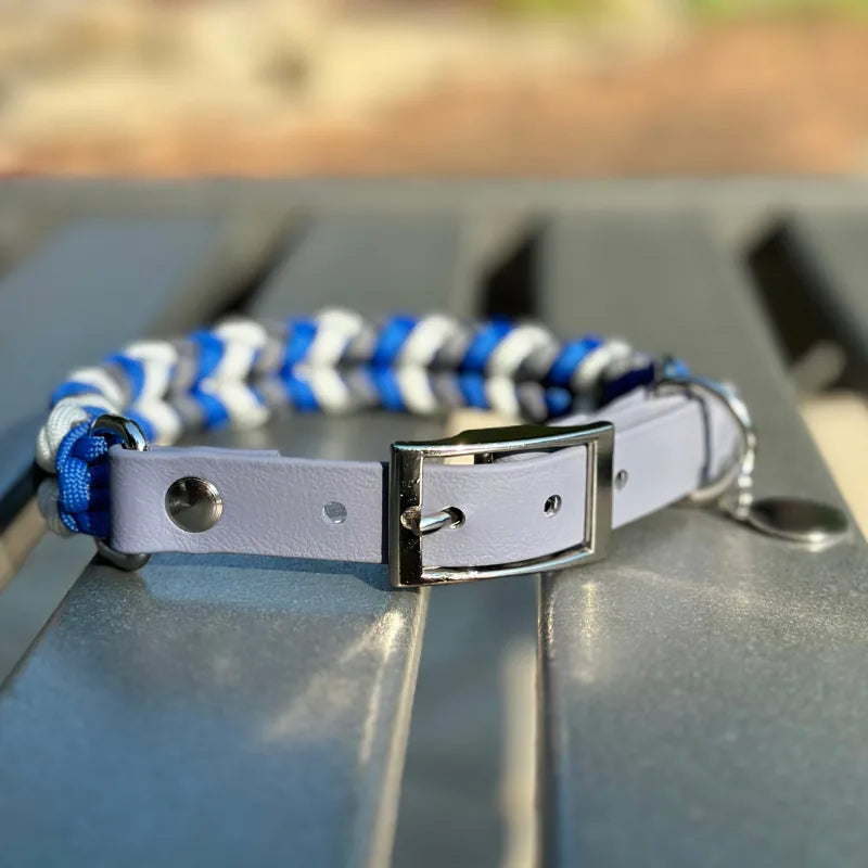 Hand-braided dog collar in royal blue, graphite, and white with a gray adjustable strap and nickel-plated buckle.
