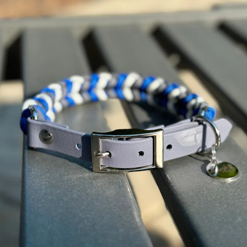 Handmade dog collar in royal blue, graphite, and white with a gray adjustable strap and nickel-plated buckle.