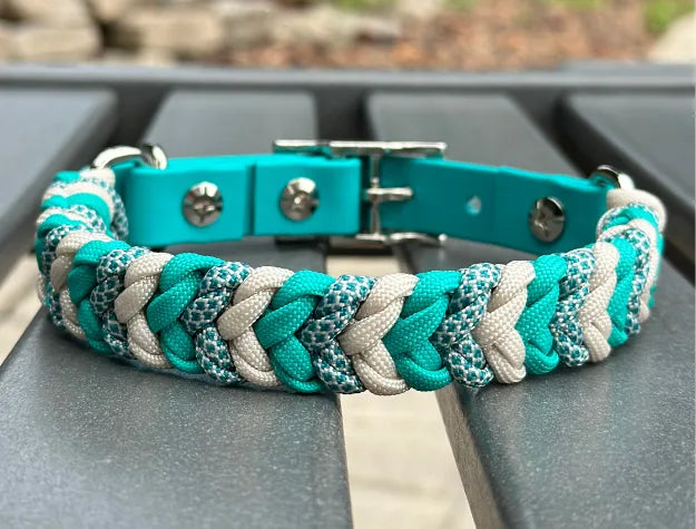 Handmade braided dog collar in teal and cream with a unique pattern, featuring a durable BioThane® adjustable adapter.