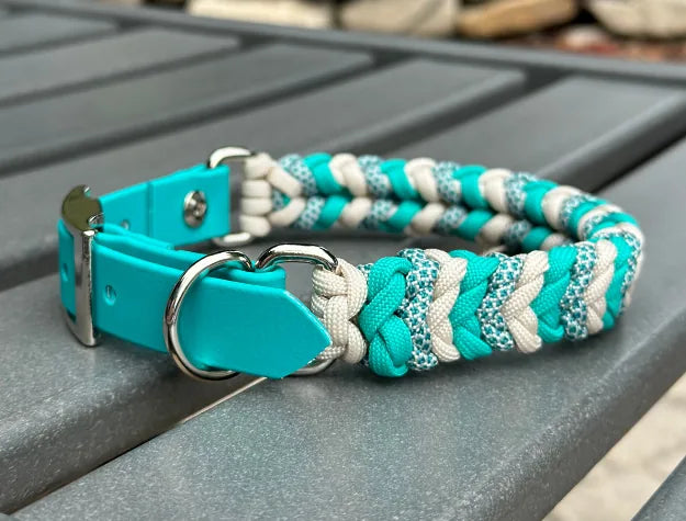 Handmade teal and cream braided dog collar features a strong D-ring and adjustable BioThane® adapter for a secure fit.