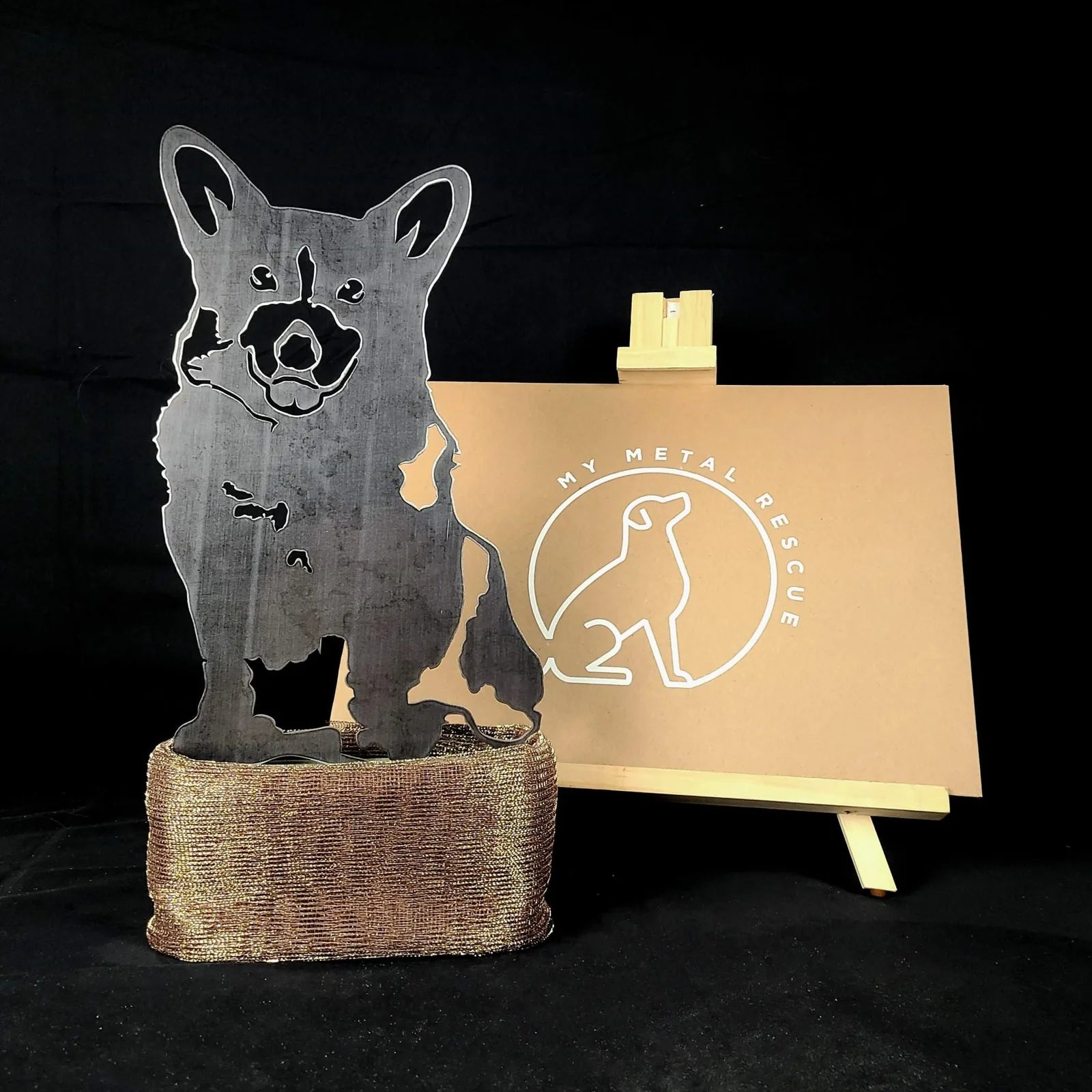 Corgi metal silhouette in dark steel on a textured base, showcasing a loving dog design by My Metal Rescue.