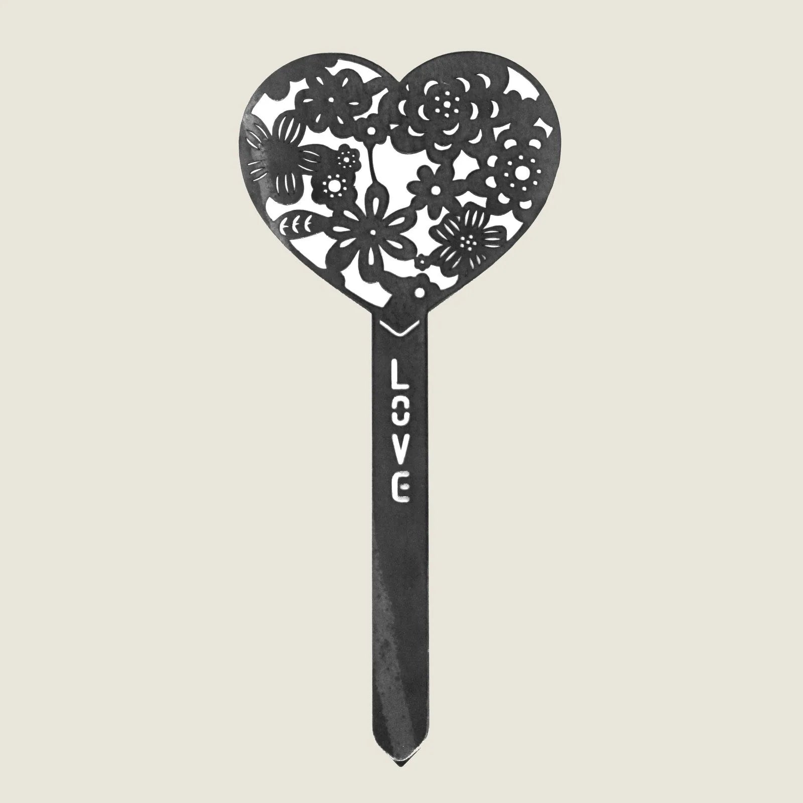 Heart-shaped Corten steel garden stake featuring floral cutouts and "LOVE" inscription, perfect for outdoor decor.