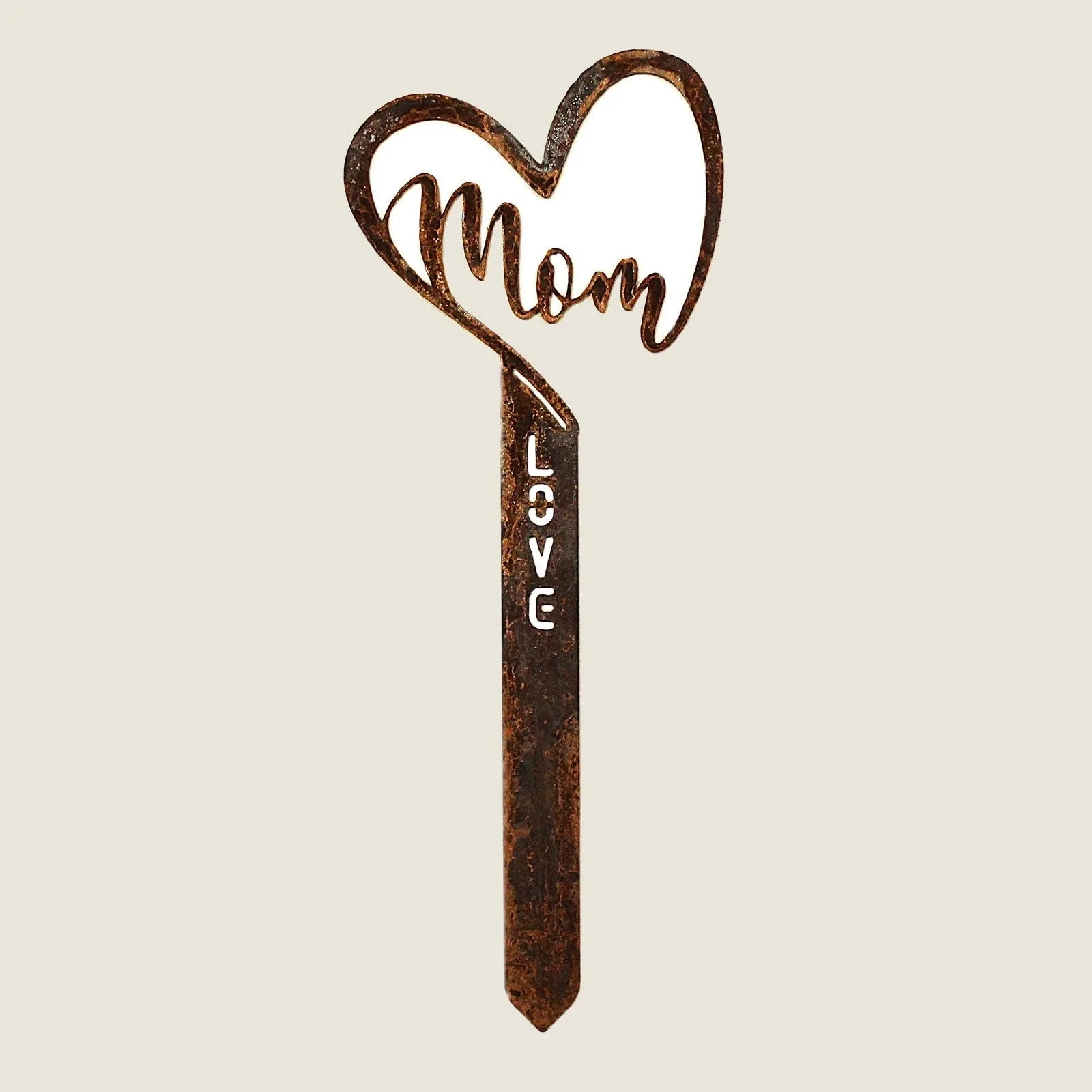 Corten steel garden stake shaped like a heart, engraved with "Mom" and "Love," showcasing a rustic brown patina.