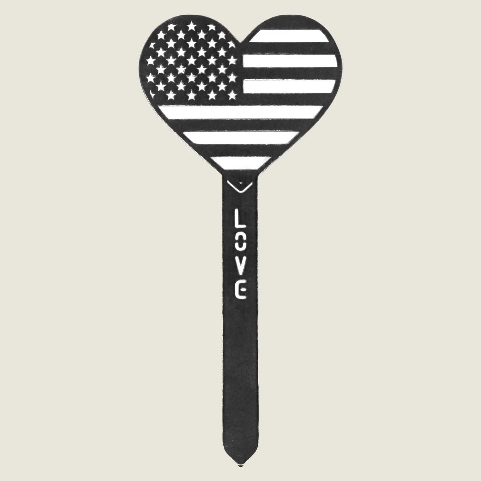 Heart-shaped garden stake featuring a US flag design, made of Corten steel with the word "LOVE" along the shaft.