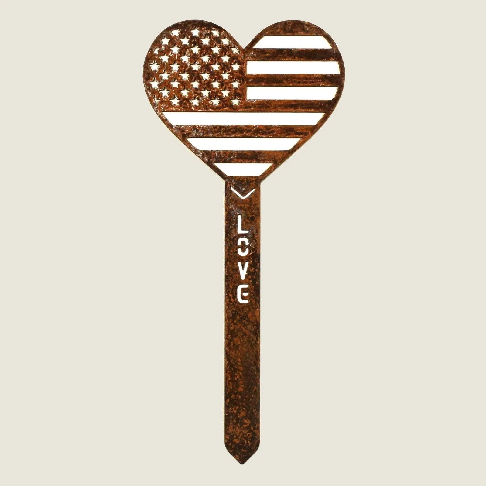 Heart-shaped Corten steel garden stake featuring an American flag design and the word "LOVE" in rustic finish.
