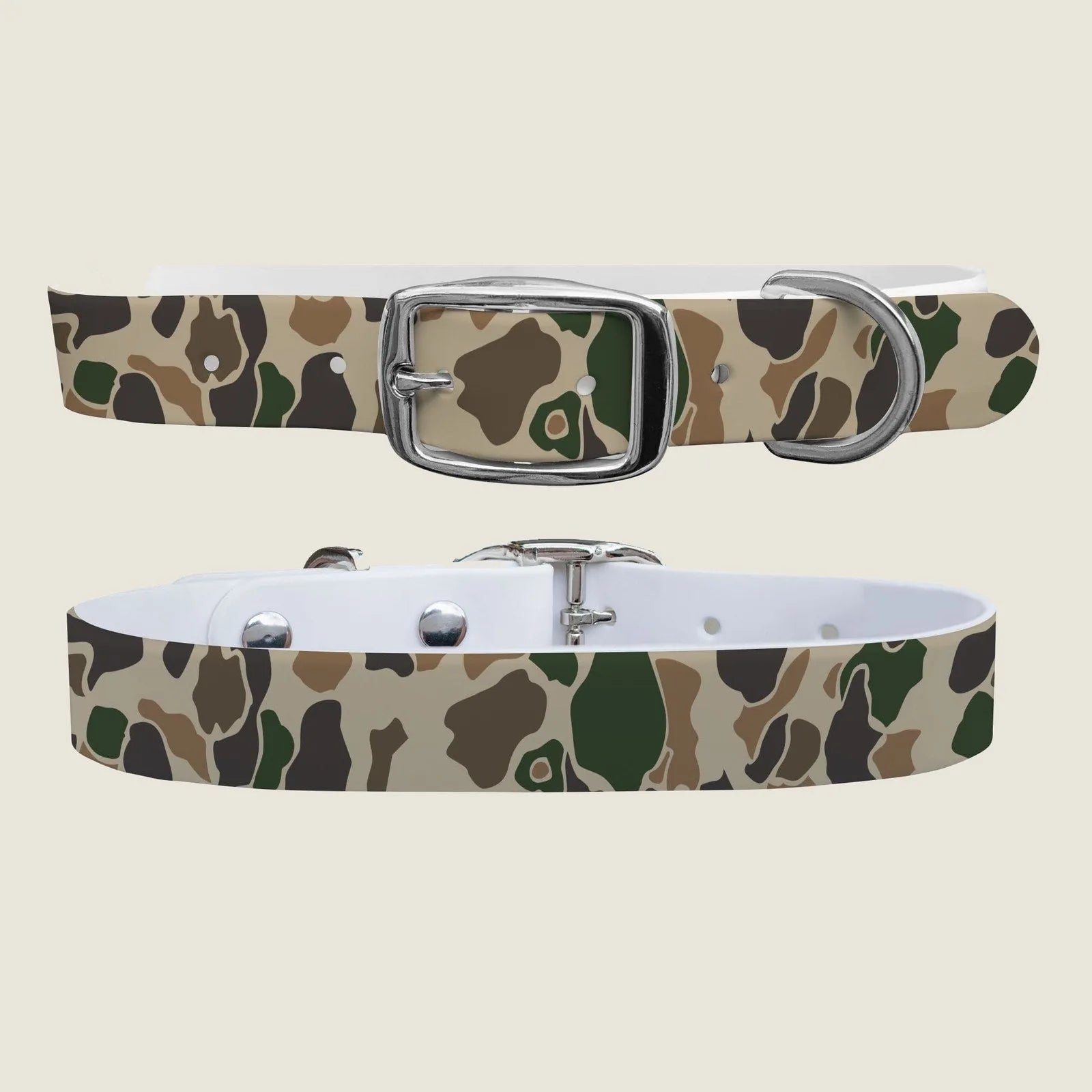 Camo-patterned dog collar in earthy tones with a sturdy silver buckle, designed for comfort and durability.