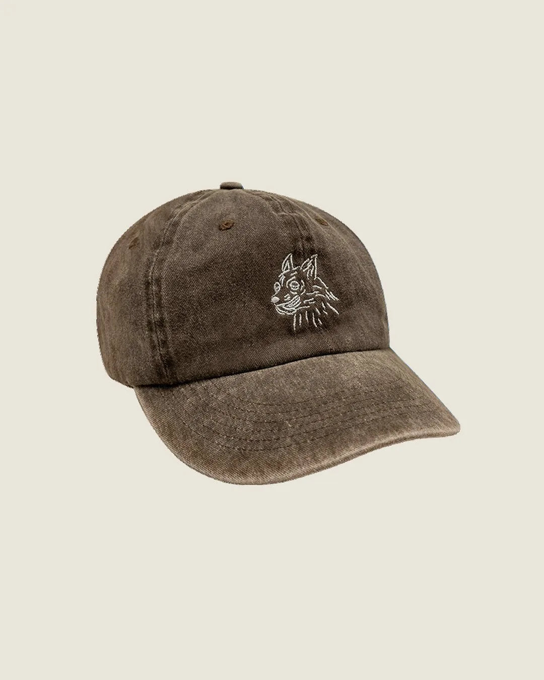 Brown unstructured cap featuring a dog illustration, crafted from 100% reclaimed cotton for dog lovers.