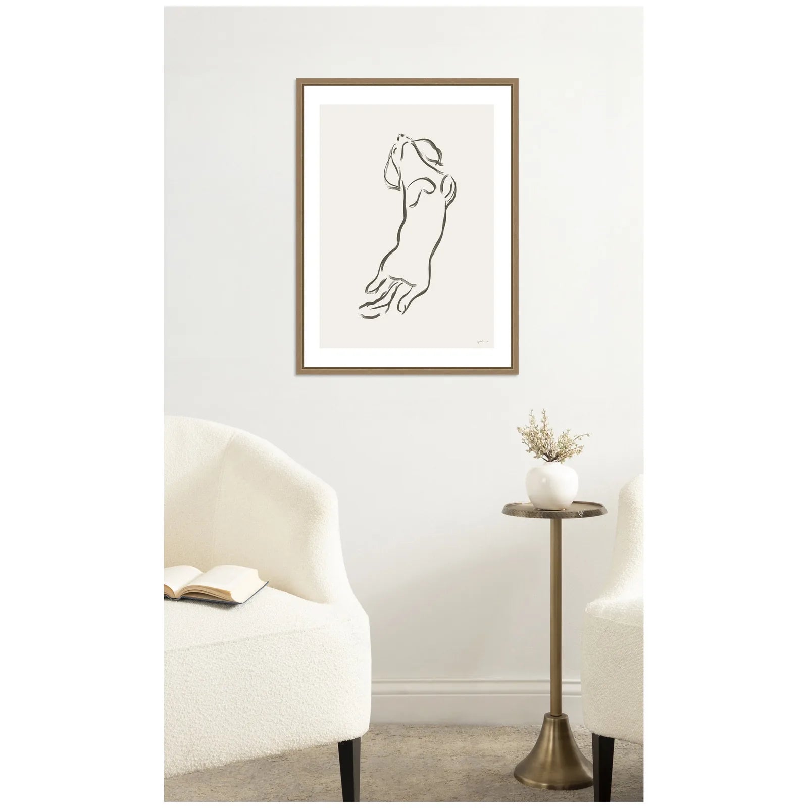 Framed canvas art featuring a minimalist line drawing of a Dachshund dog, set in a dark gold frame.