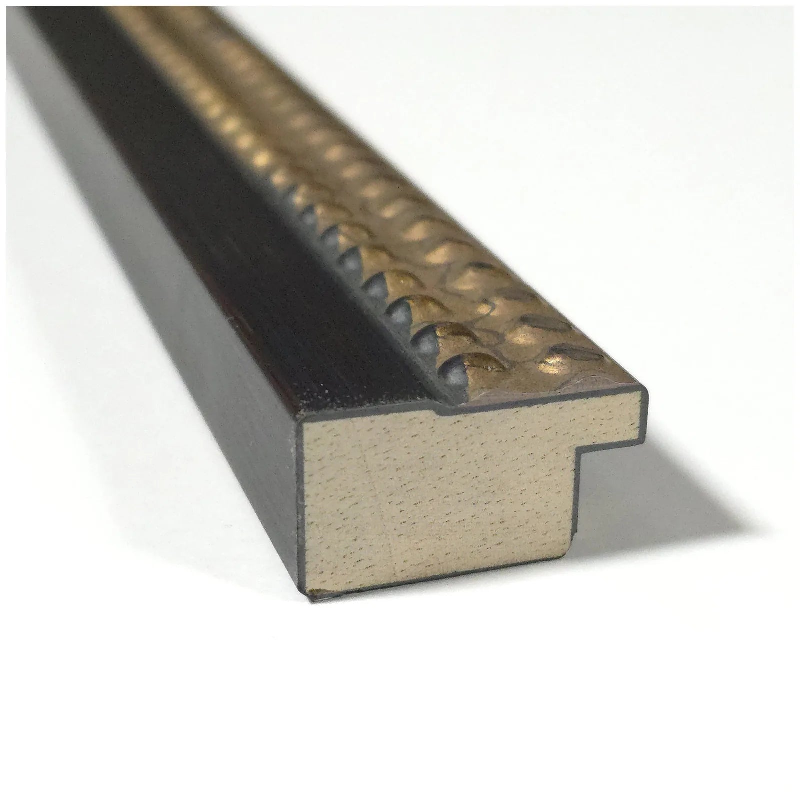 Close-up of the Castellan Black designer moulding frame with a textured gold top edge, showcasing quality craftsmanship.
