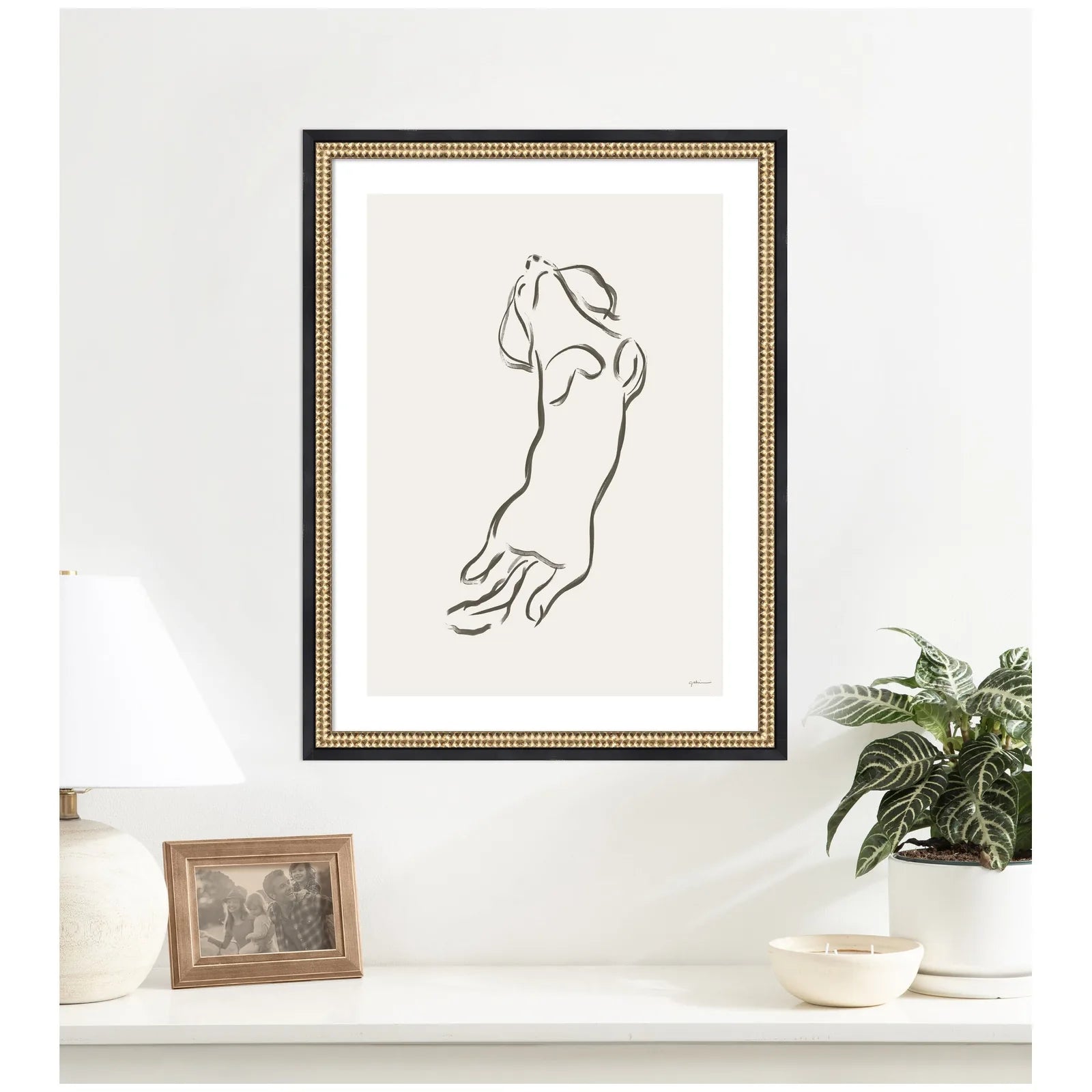 Dachshund wall art print in a Castellan Black frame, featuring a minimalist design against a light background.