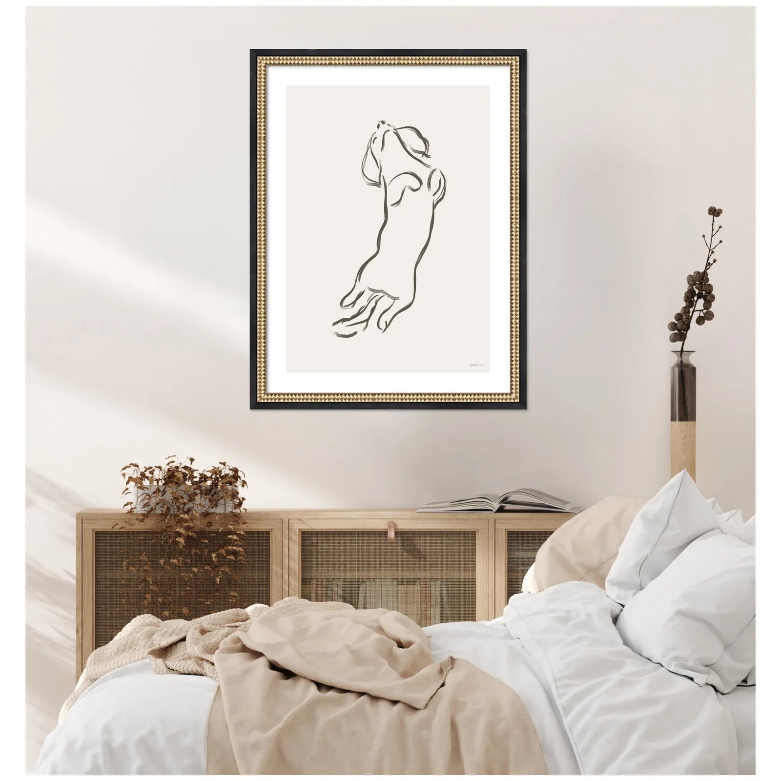 Framed wall art of a Dachshund dog in a simplistic line design, showcased in a Castellan Black frame.