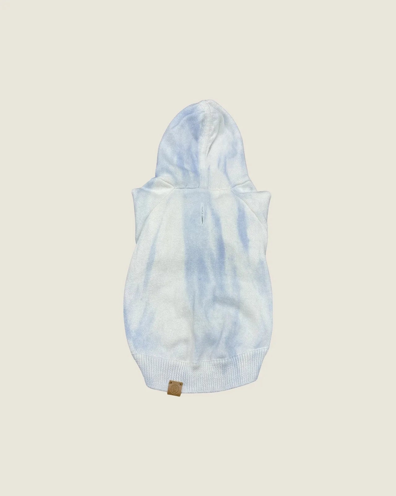 Sky blue tie-dye dog hoodie with a soft cotton-blend, featuring a back buttonhole for leash access and knit-finished edges.