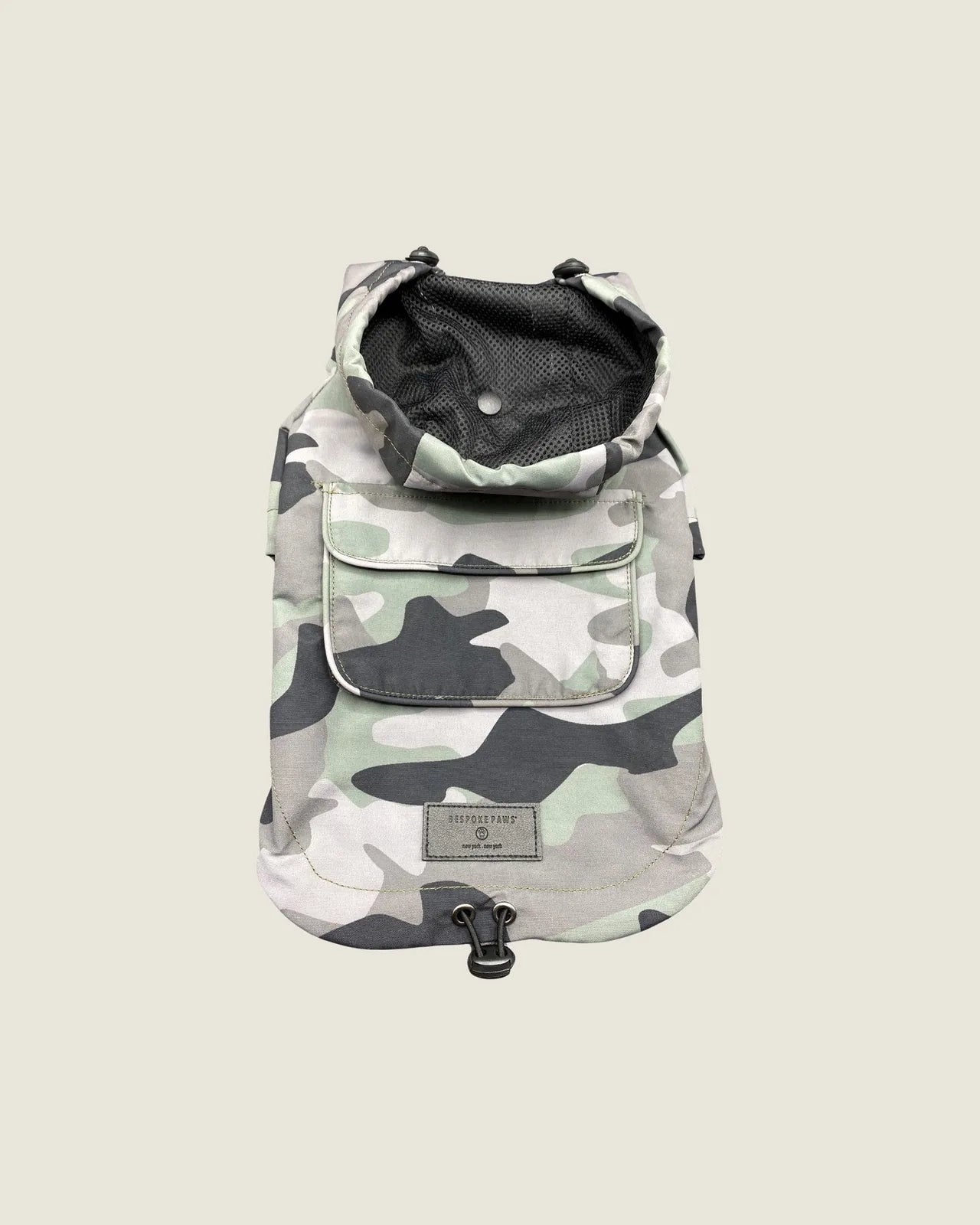 Olive camouflage waterproof dog raincoat with adjustable straps and a zippered pocket for storage.