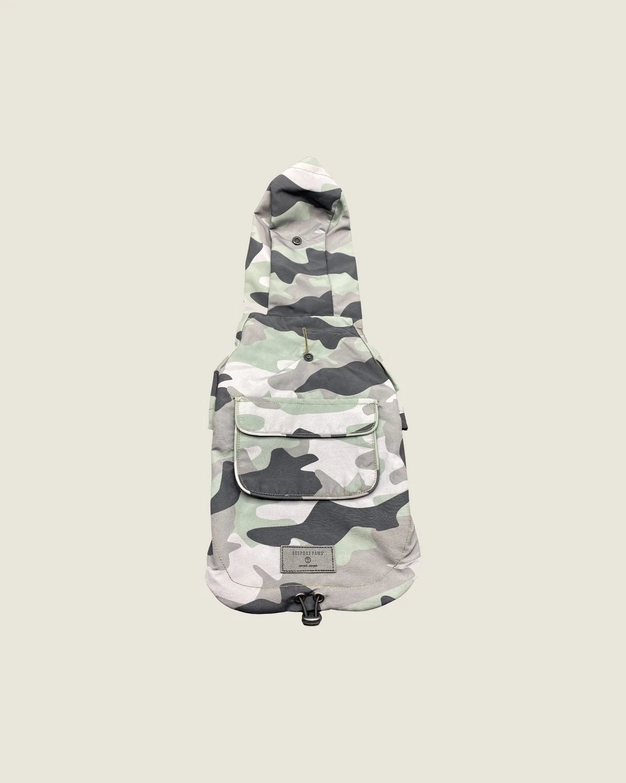 Olive camouflage 'Dani' waterproof dog raincoat with hood and front pocket, designed for comfort and protection.