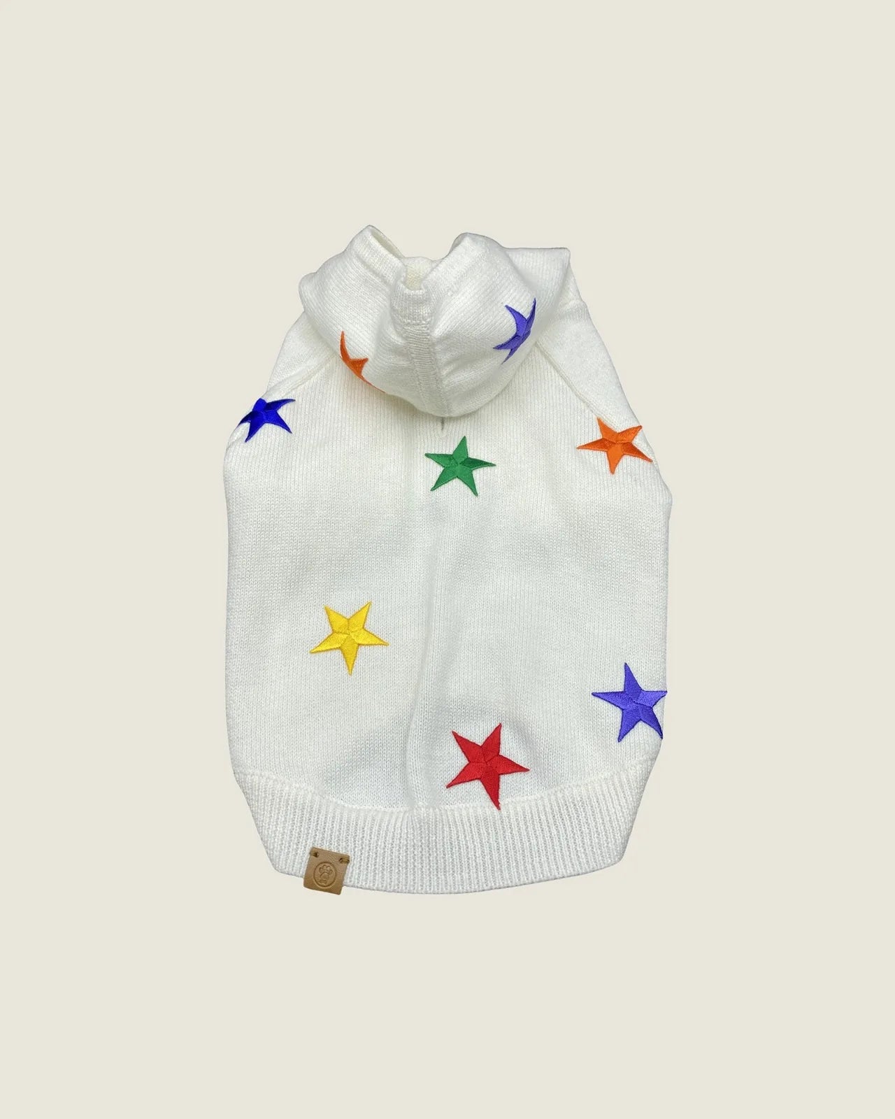 Cozy white hoodie for dogs featuring colorful star patches in red, yellow, green, purple, and orange.